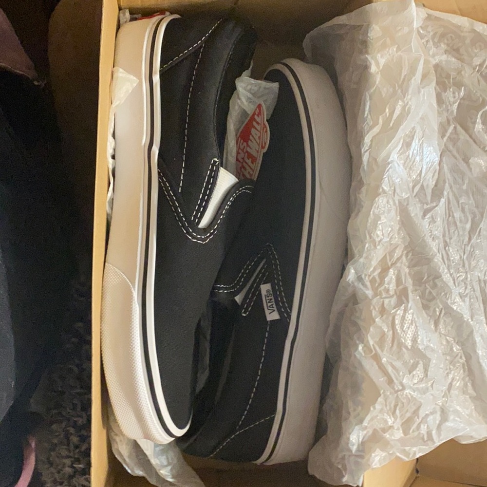 Black slip on vans. Woman’s size 7.